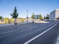 the empty city road is empty except for signs to tell you where to go and not to