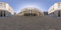 a 360 - camera image of an empty city square and the building in the background