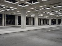 empty city street in concrete building structure with white ceiling tiles on roof area and people walking