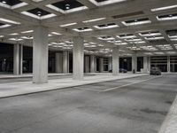 empty city street in concrete building structure with white ceiling tiles on roof area and people walking