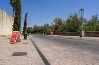 the empty city street is clean and has signs on it advertising people to choose the right