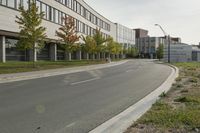 the empty city street is empty with no traffic on it, so no people are crossing the streets