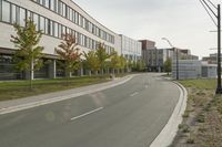 the empty city street is empty with no traffic on it, so no people are crossing the streets