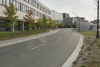 the empty city street is empty with no traffic on it, so no people are crossing the streets