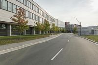 the empty city street is empty with no traffic on it, so no people are crossing the streets