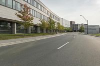 the empty city street is empty with no traffic on it, so no people are crossing the streets