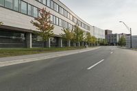 the empty city street is empty with no traffic on it, so no people are crossing the streets