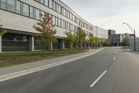 the empty city street is empty with no traffic on it, so no people are crossing the streets