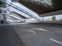 the empty city street is empty and ready to be used for traffic purposes, including the bridge