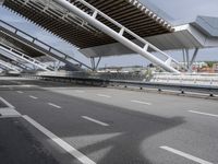 the empty city street is empty and ready to be used for traffic purposes, including the bridge