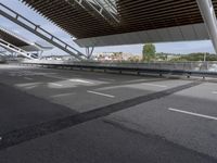 the empty city street is empty and ready to be used for traffic purposes, including the bridge