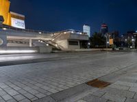 an empty city street with no cars in it at night time or night time,