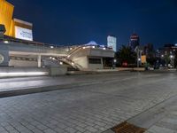 an empty city street with no cars in it at night time or night time,