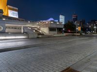 an empty city street with no cars in it at night time or night time,