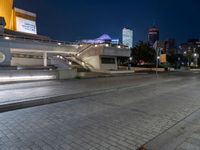 an empty city street with no cars in it at night time or night time,