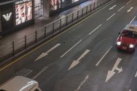 the streets and signs are both empty at night with no people on it and a person crossing