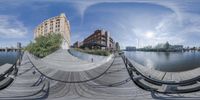 the 360 - ray panorama shows an empty city waterfront in the distance, buildings and a bridge