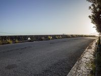 the road is empty as it looks for some cars to travel on from home and away