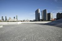 the concrete is clean and empty but there is no sky in sight for all of the building to see