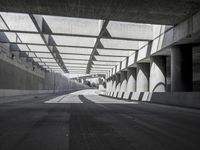 there is a long empty concrete road in the city of la habraca, mexico