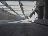 there is a long empty concrete road in the city of la habraca, mexico