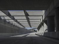 there is a long empty concrete road in the city of la habraca, mexico