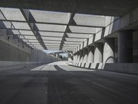 there is a long empty concrete road in the city of la habraca, mexico