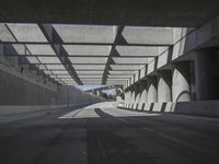 there is a long empty concrete road in the city of la habraca, mexico