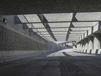 there is a long empty concrete road in the city of la habraca, mexico