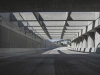 there is a long empty concrete road in the city of la habraca, mexico