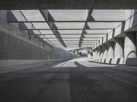 there is a long empty concrete road in the city of la habraca, mexico