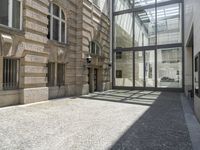 the empty courtyard in an old european building is seen from the front angle up view