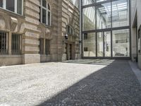 the empty courtyard in an old european building is seen from the front angle up view