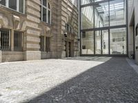 the empty courtyard in an old european building is seen from the front angle up view