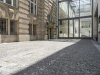 the empty courtyard in an old european building is seen from the front angle up view