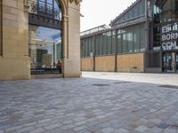 the empty courtyard of an open - air market is pictured in this photograph with a sign for ed burr