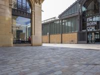 the empty courtyard of an open - air market is pictured in this photograph with a sign for ed burr