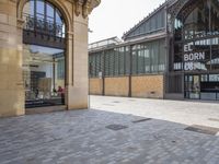 the empty courtyard of an open - air market is pictured in this photograph with a sign for ed burr