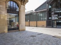 the empty courtyard of an open - air market is pictured in this photograph with a sign for ed burr