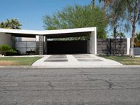 an empty driveway with no cars on the side and no trees on the other side