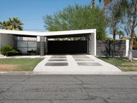 an empty driveway with no cars on the side and no trees on the other side