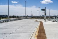 an empty freeway area with no one on it, as well as a bridge above