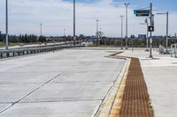 an empty freeway area with no one on it, as well as a bridge above