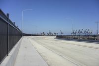 the freeway is empty and empty, with several light poles and a street light in it