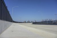 the freeway is empty and empty, with several light poles and a street light in it