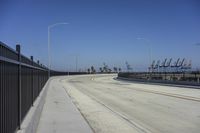 the freeway is empty and empty, with several light poles and a street light in it