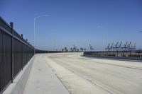 the freeway is empty and empty, with several light poles and a street light in it