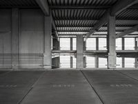 empty garage with no one on it, black and white photo by mark ebersel