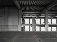 empty garage with no one on it, black and white photo by mark ebersel