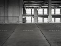 empty garage with no one on it, black and white photo by mark ebersel